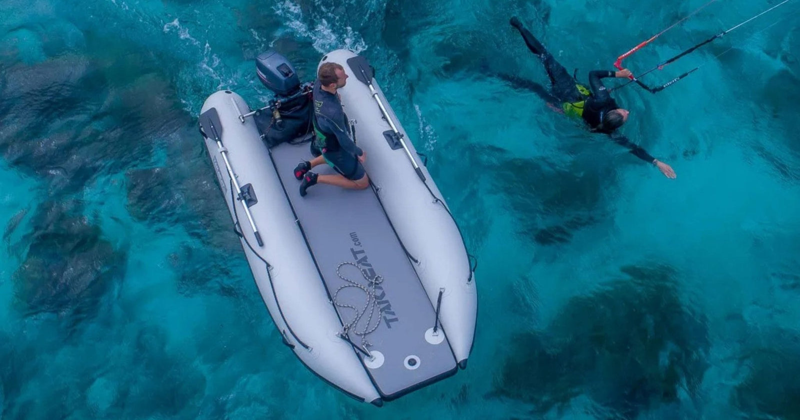 takacat inflatable dinghy on the water with two people